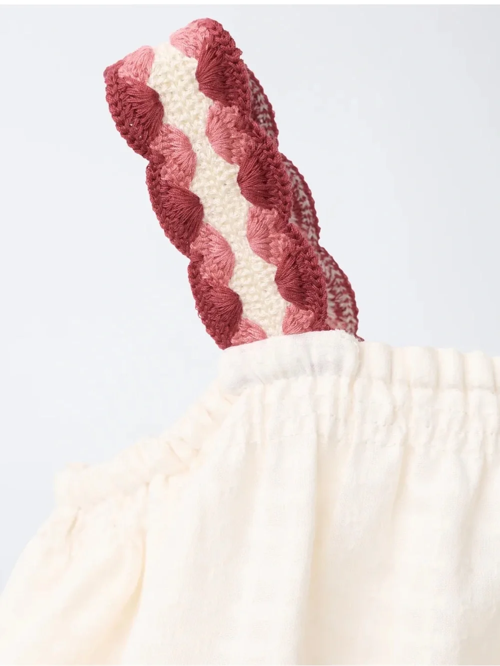 100% cotton jumpsuit with crochet pocket and straps